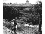 A man sows seed on the higher slopes of the Mount of Olives, not far from the village of Bethany. An early photograph.